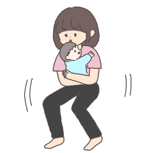 赤ちゃんを抱っこしながらスクワットであやす女性